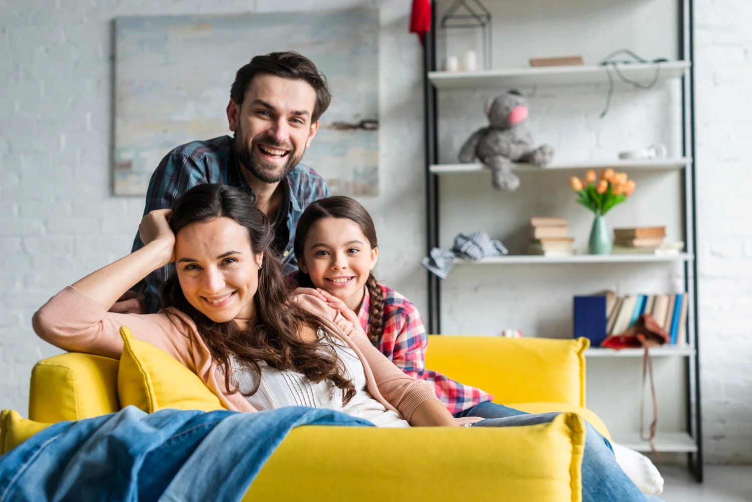 Happy family sitting on a couch in a living room